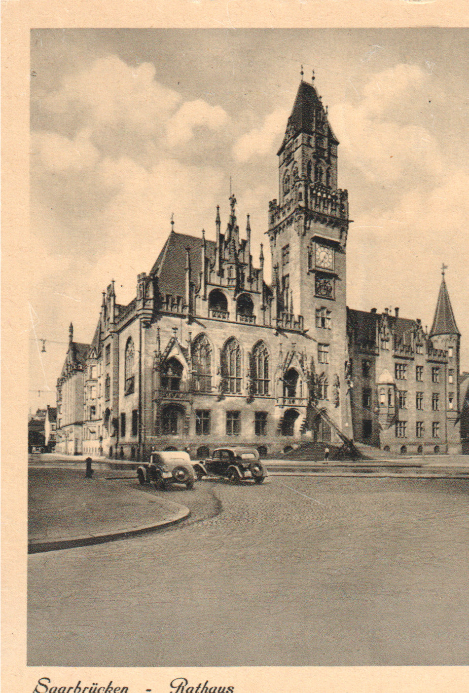 Vintage postcard depicting Saarbrücken Rathaus, showcasing Gothic-style architecture. - Image: 2025-04-18-0070
