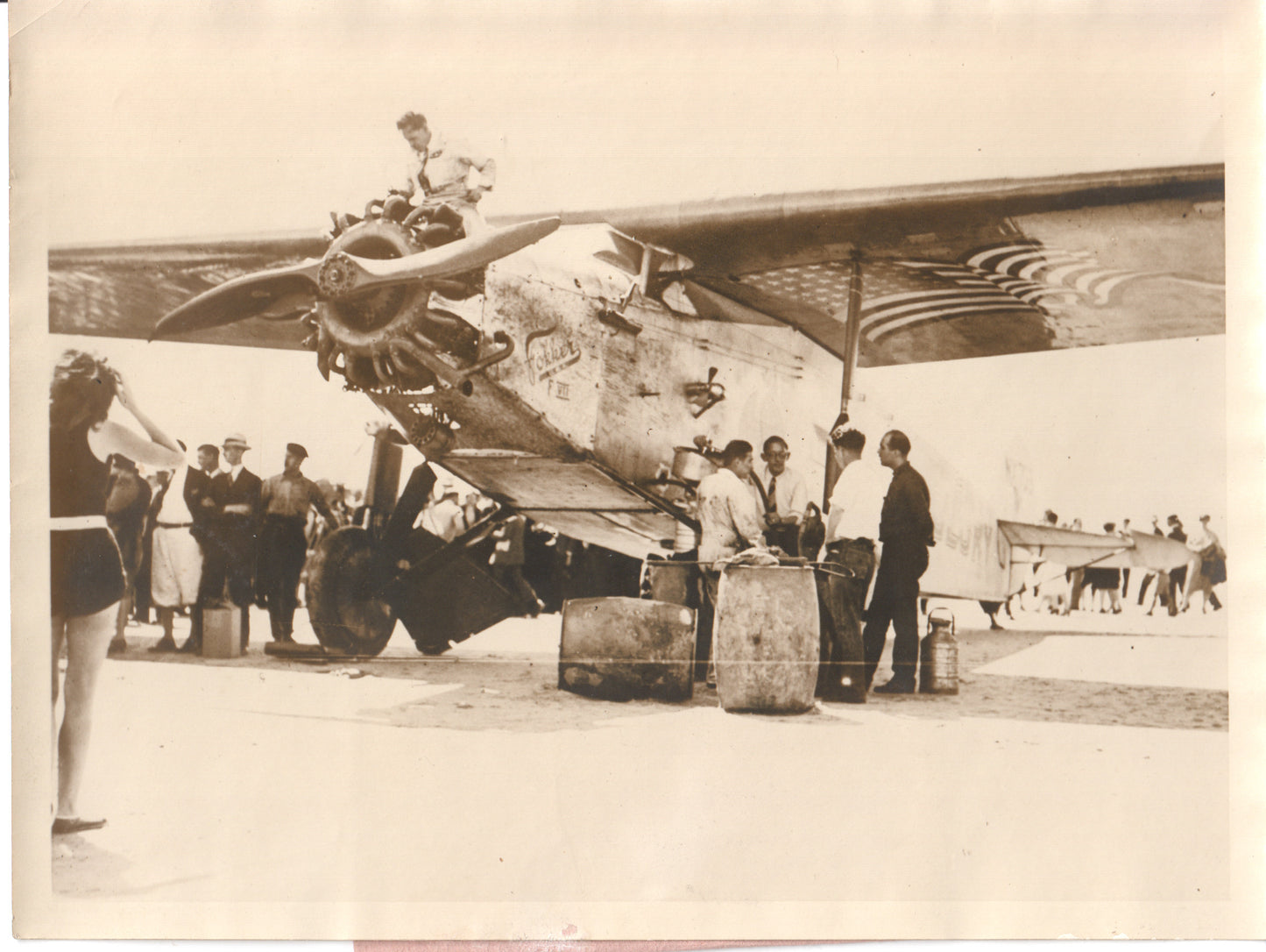 Vintage 1920s photograph of mechanics working on a propeller aircraft. - Image: Folder25-7