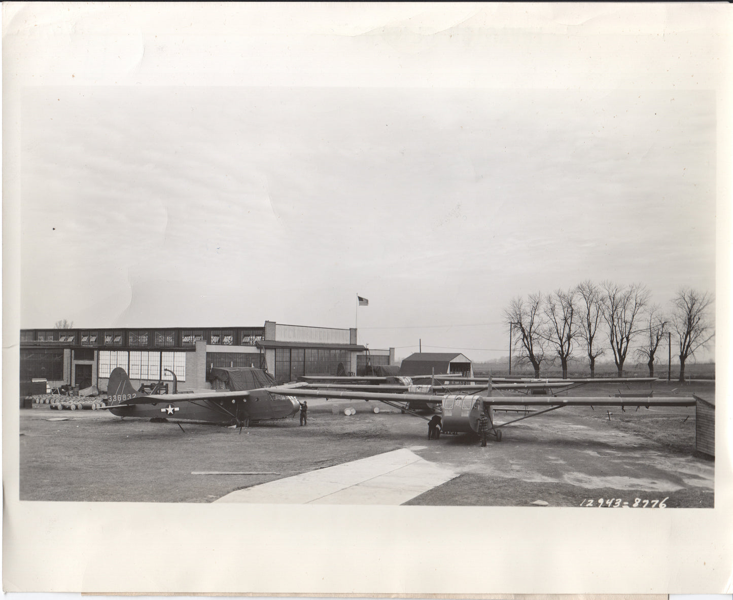 Vintage black and white photograph of a military aircraft on a tarmac. - Image: Folder22-3