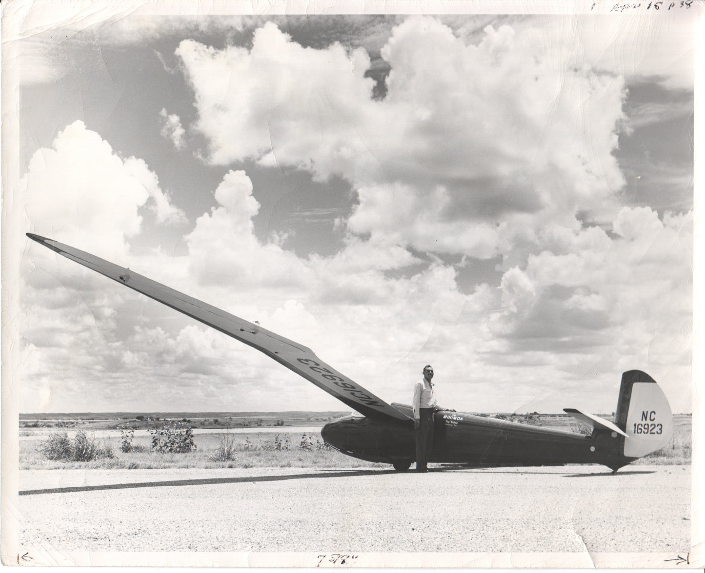 Black and white photo of a glider and its pilot in an open landscape. - Image: Folder25-23