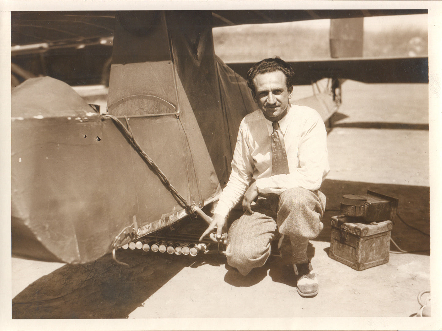Vintage photo of a mechanic next to an early aircraft in the 1920s. - Image: Folder24-15