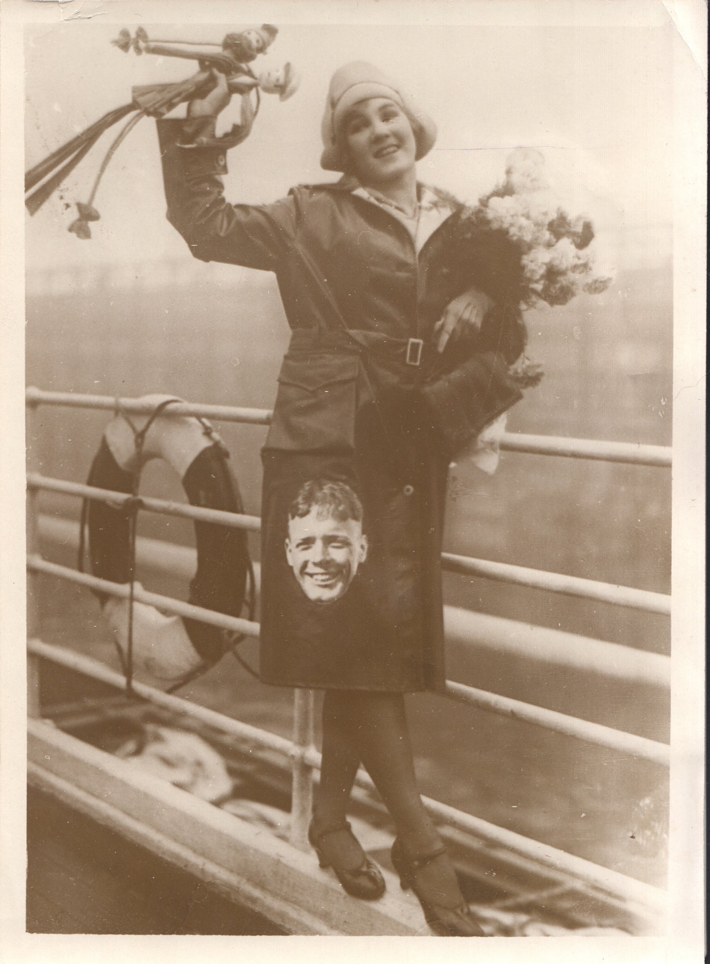 Vintage black-and-white photo of a woman in a raincoat against a nautical background. - Image: Folder19-1