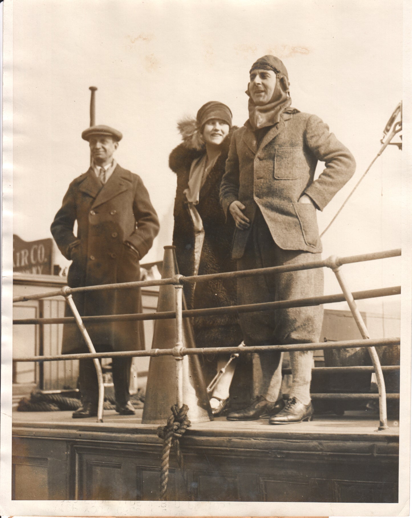 Vintage photograph of three people on a ship deck in the 1920s. - Image: Folder25-17