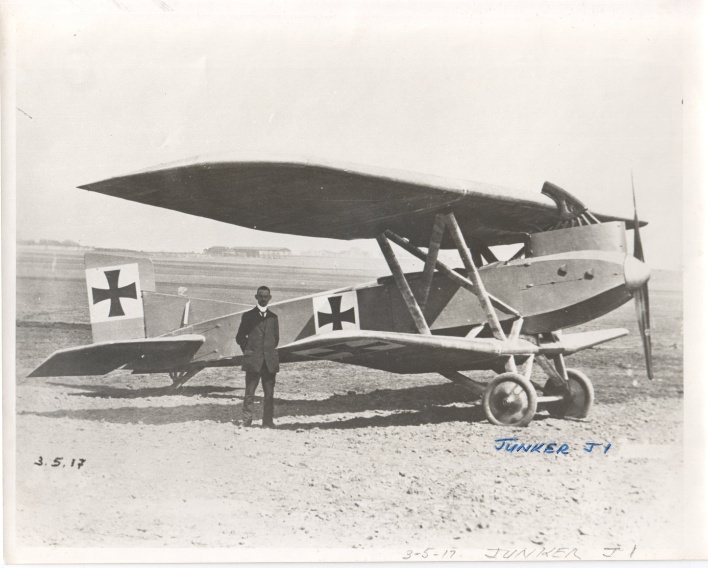 Vintage photograph of the Junkers J1 biplane with a pilot standing beside it. - Image: Folder16-3