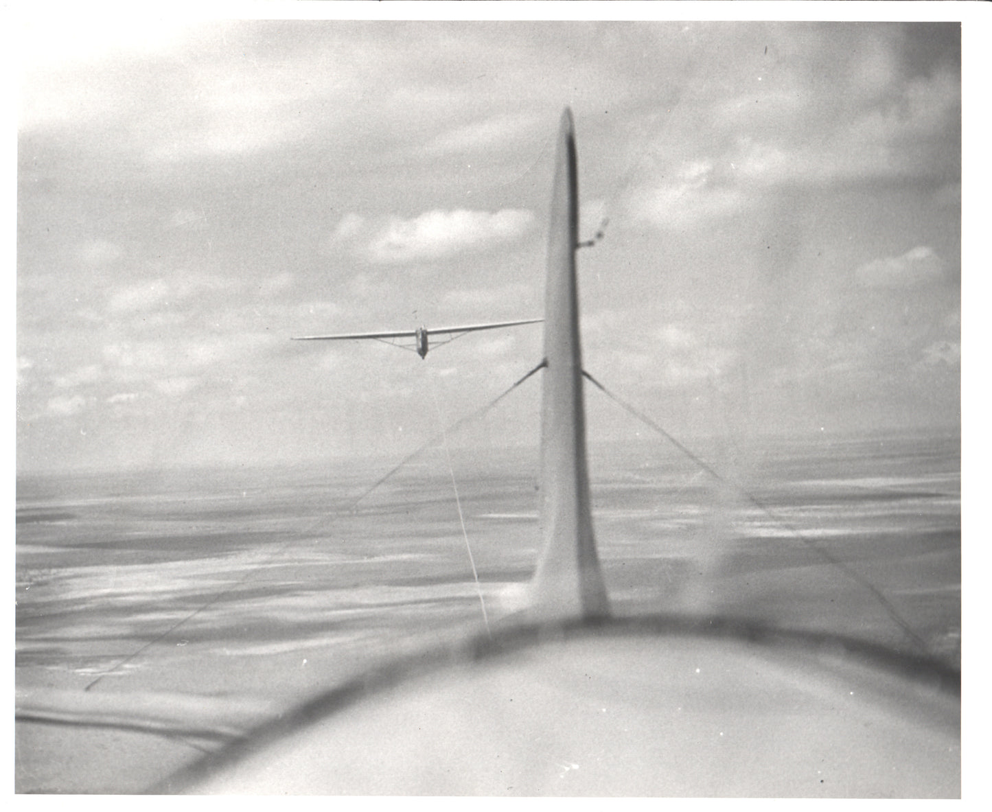 Vintage aerial photograph featuring a glider being towed. - Image: Folder20-21