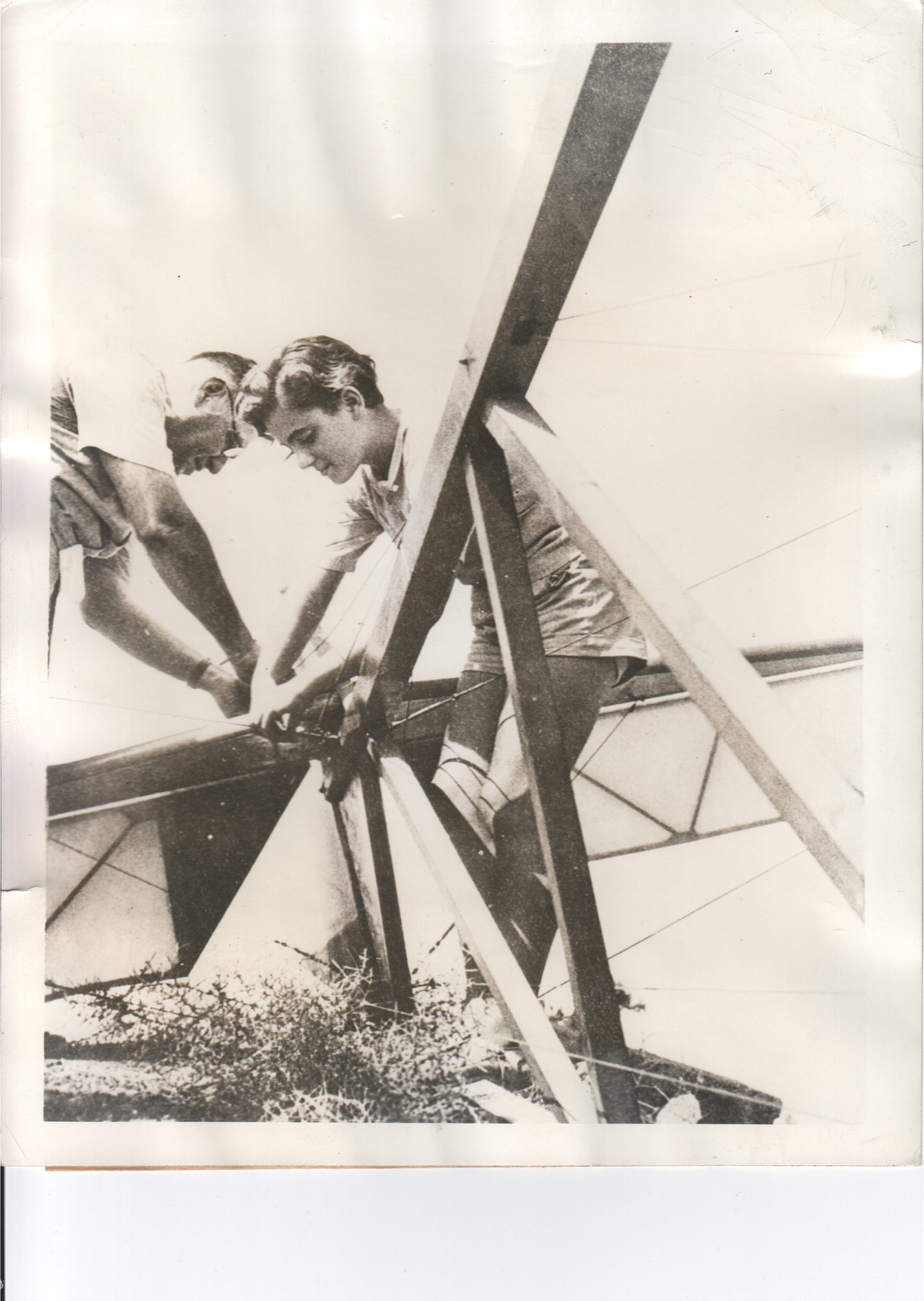 Two young men building a glider in a vintage black and white photograph. - Image: Folder3-19