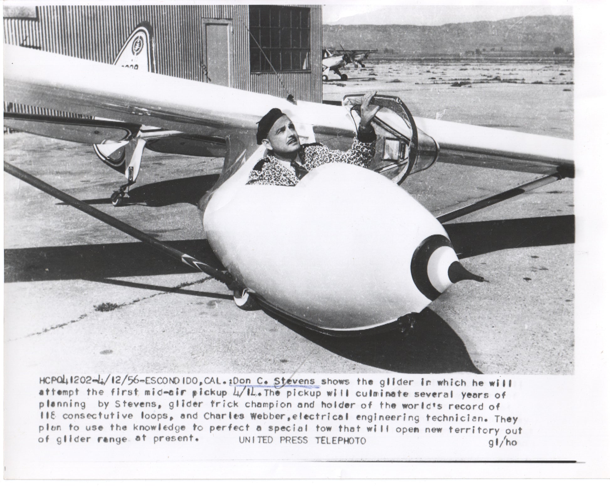Black and white photo of glider pilot Don C. Stevens preparing for a mid-air pickup attempt in 1956. - Image: Folder14-3