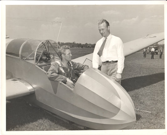 Vintage photograph of two men by a glider aircraft. - Image: Folder20-13