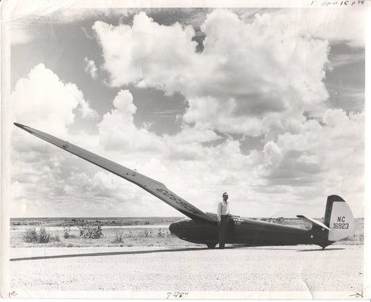 Black and white photo of a glider and its pilot in an open landscape. - Image: Folder25-23