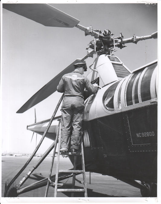 Black and white photo of a technician working on a helicopter - Image: Folder25-9