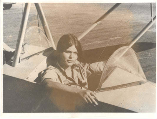 Vintage photograph of a female pilot in the cockpit of an aircraft. - Image: Folder22-16