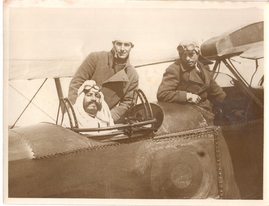 Three aviators in vintage gear next to an early biplane. - Image: Folder27-5