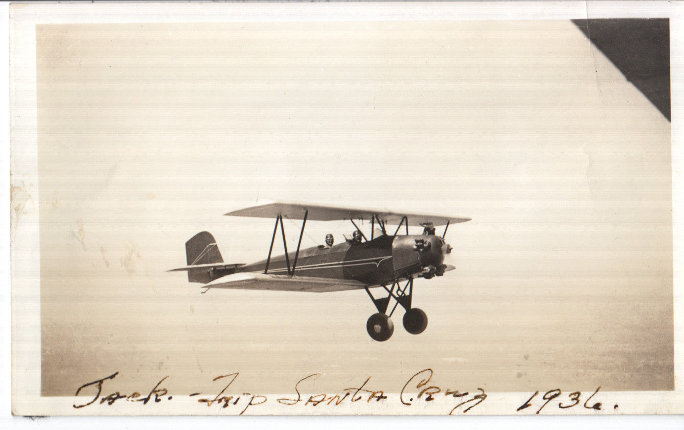 A vintage black and white photograph of an airplane in flight, dated 1936. - Image: Folder9-3