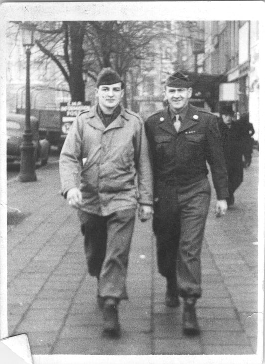 Vintage black and white photo of two soldiers walking on a city street. - Image: 2025-08-25-0025