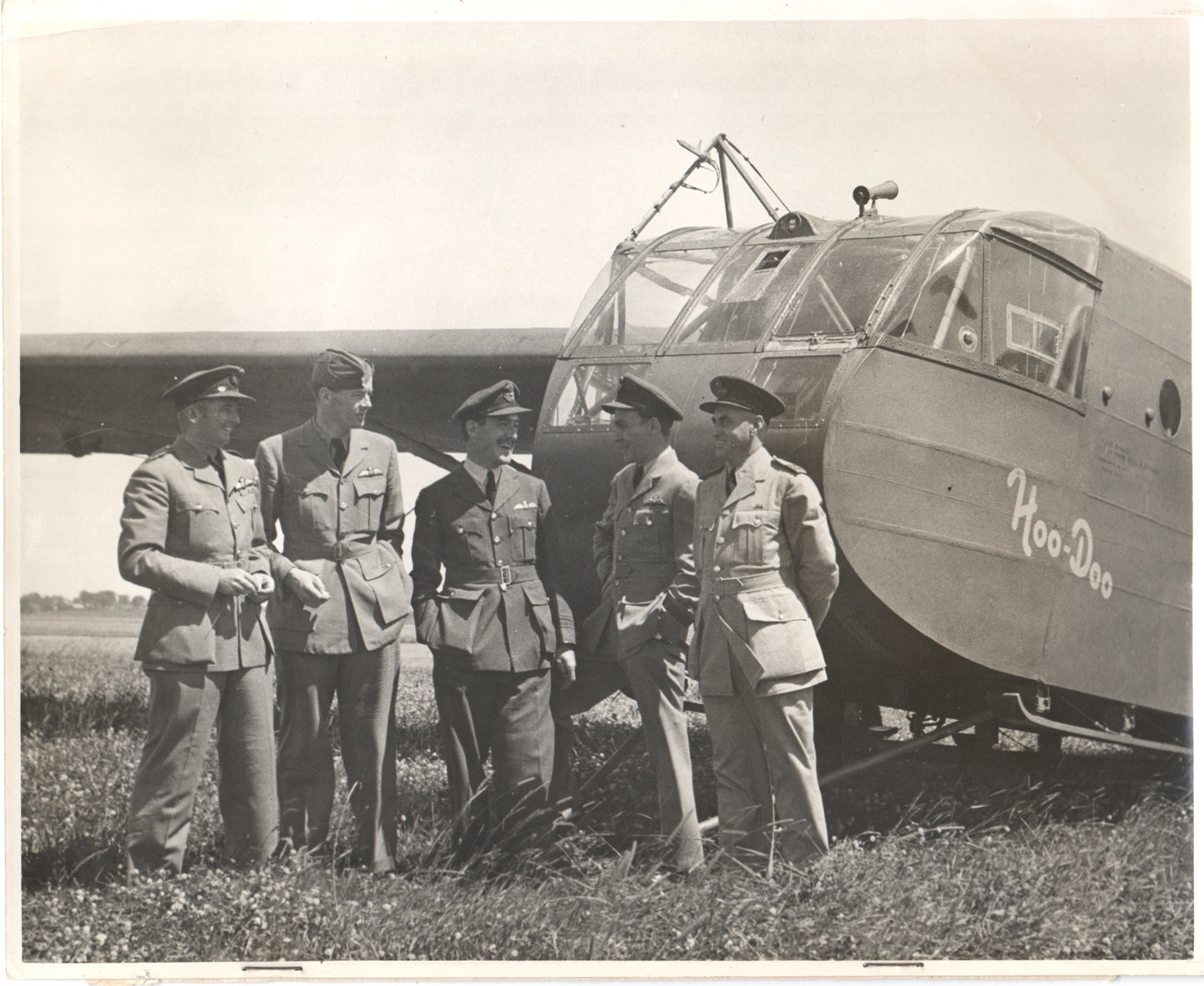 Vintage WWII photo of military officers beside the "Hoo-Doo" aircraft. - Image: Folder13-2
