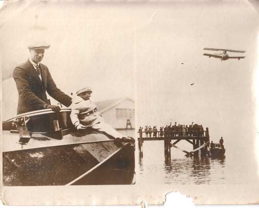 Vintage photograph of a man and child on a boat with a biplane overhead and crowd on a pier. - Image: Folder15-7