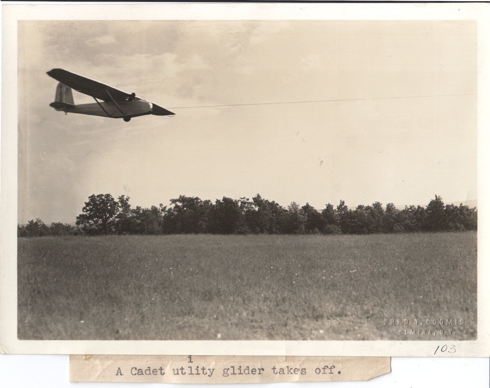 Vintage black and white photo of a Cadet utility glider taking off. - Image: Folder27-21