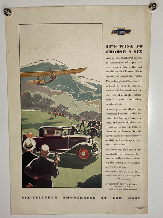 Vintage advertisement featuring a Chevrolet Six automobile and an airplane in a scenic landscape. (File: F11F11IMG_1709.JPG)