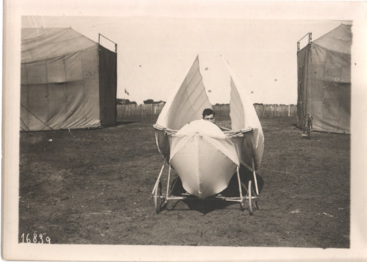 Vintage circus prop featuring a winged design aerial scooter. - Image: Folder28-3