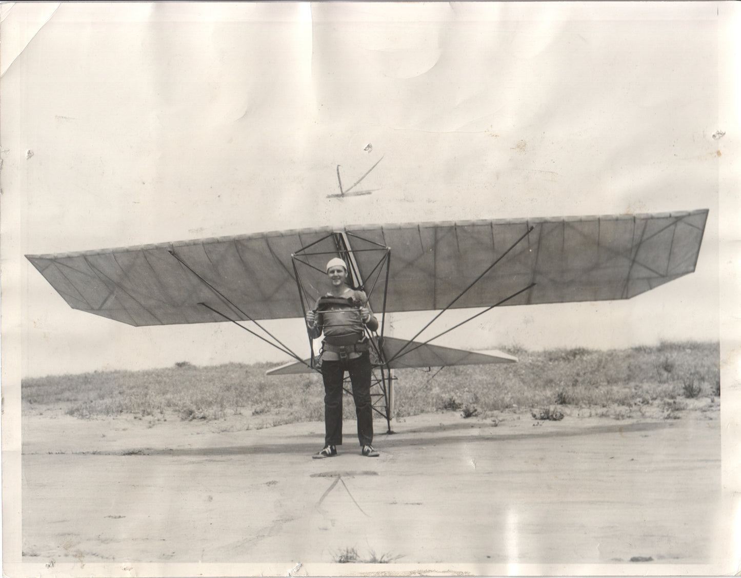 Early 20th century aviator posing with a glider in a black and white photograph. - Image: Folder10-7