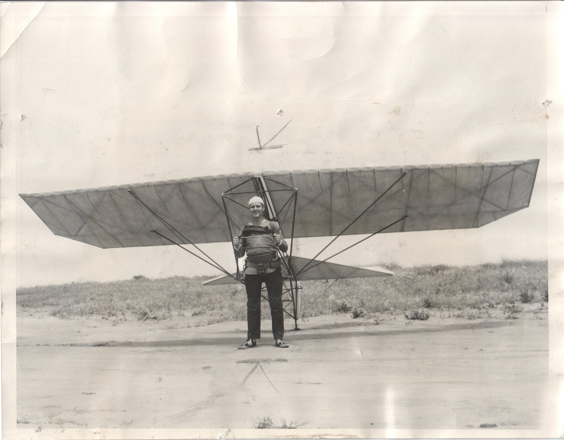 Early 20th century aviator posing with a glider in a black and white photograph. - Image: Folder10-7