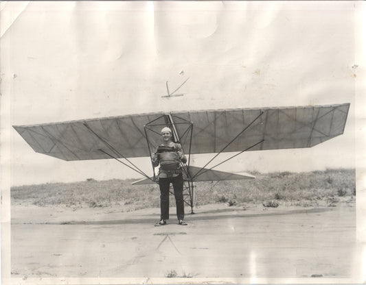 Early 20th century aviator posing with a glider in a black and white photograph. - Image: Folder10-7