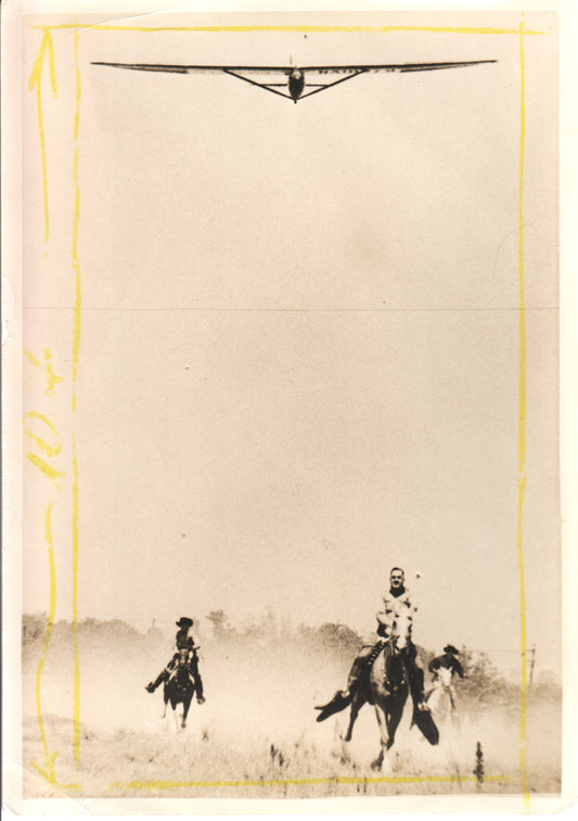 Vintage photograph of two horsemen with a glider overhead. - Image: Folder10-3