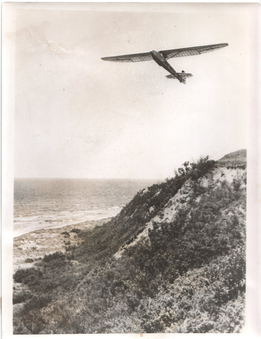 Vintage black and white photo of a glider flying over the coast. - Image: Folder17-3