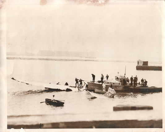 Black and white photograph of a tugboat and crew on a foggy waterway. - Image: Folder25-1