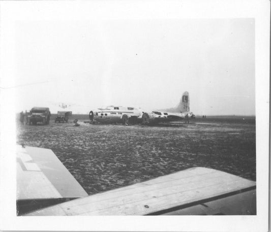 Vintage black and white photo of a B-17 bomber wreck on an airfield. - Image: 2025-08-25-0072