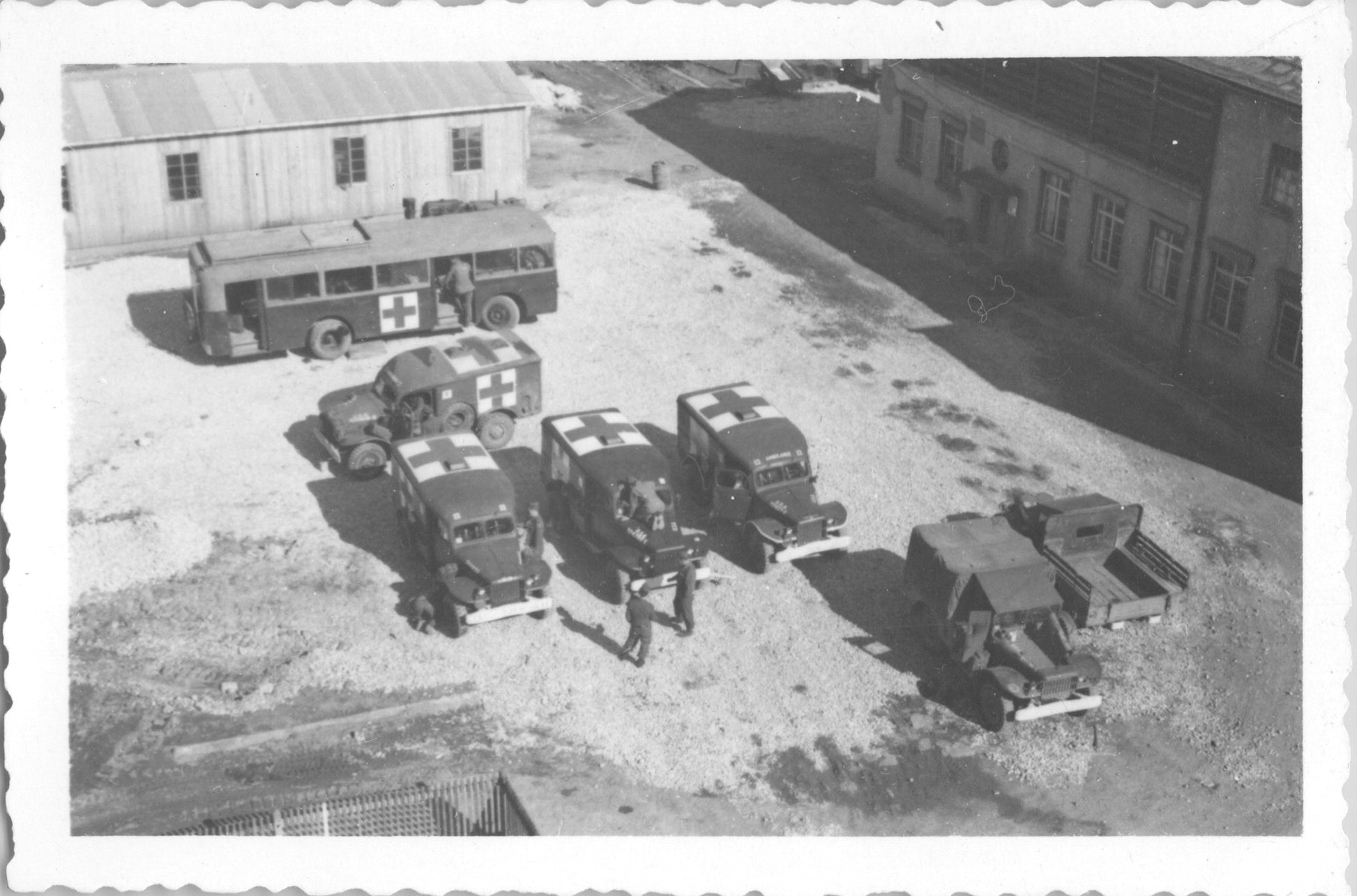 Aerial view of a World War II medical convoy with ambulances and a bus. - Image: 2025-08-25-0046