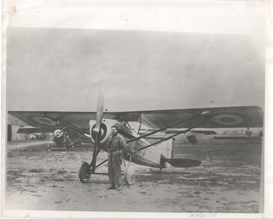 Black and white photograph of an aviator with a French bi-plane from the early 20th century. - Image: Folder26-14