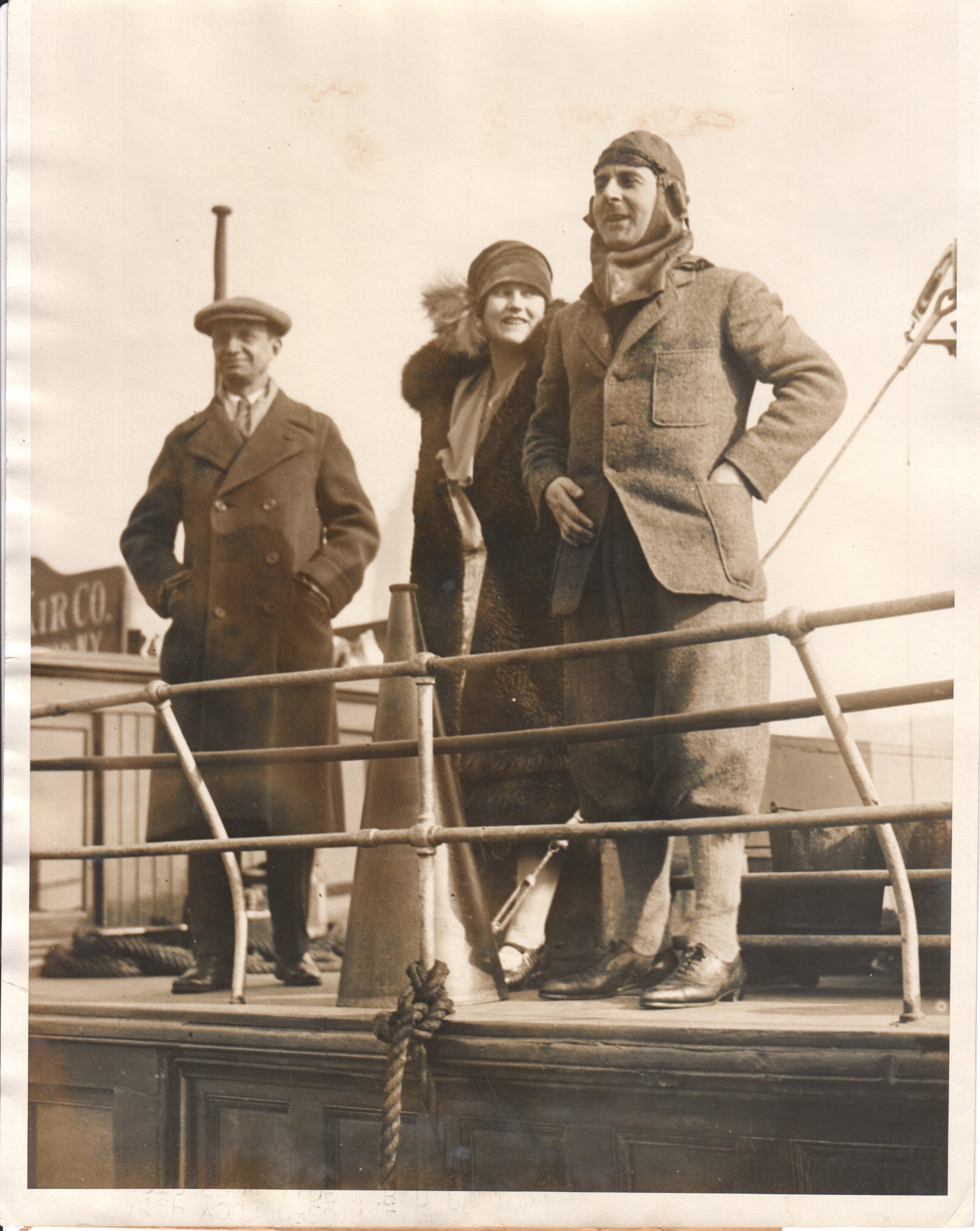 Vintage photograph of three people on a ship deck in the 1920s. - Image: Folder25-17