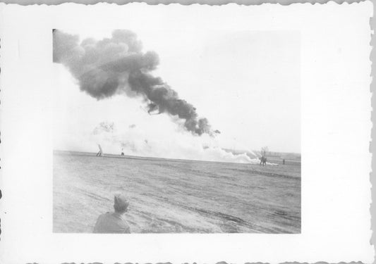 Black and white photo of a firefighting demonstration with smoke rising in the background. - Image: 2025-08-25-0061