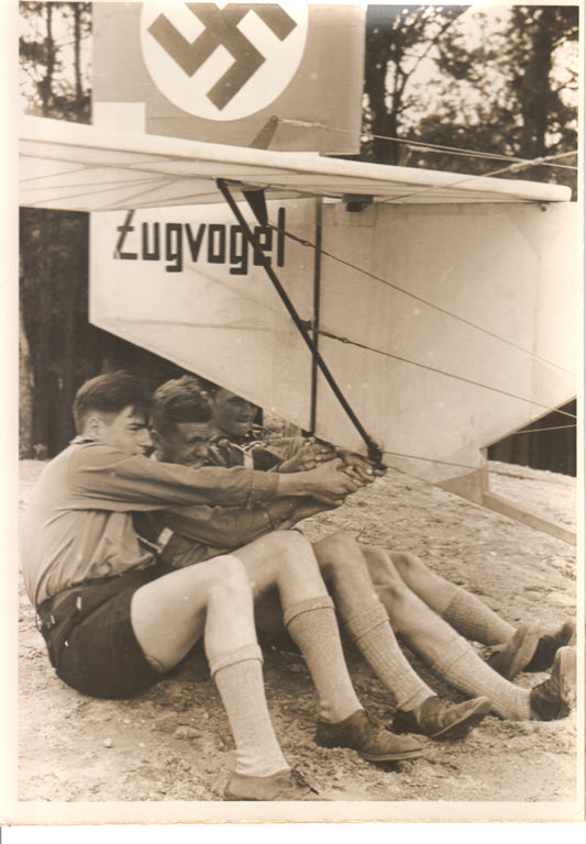 Vintage photo displaying boys training with a Zugvogel glider in a natural setting. - Image: Folder3-3