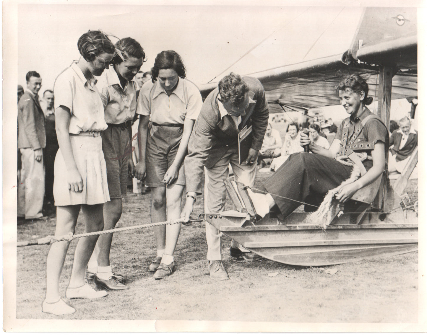 Vintage photograph of women engaging with an aircraft at an airshow in the 1930s. - Image: Folder14-5