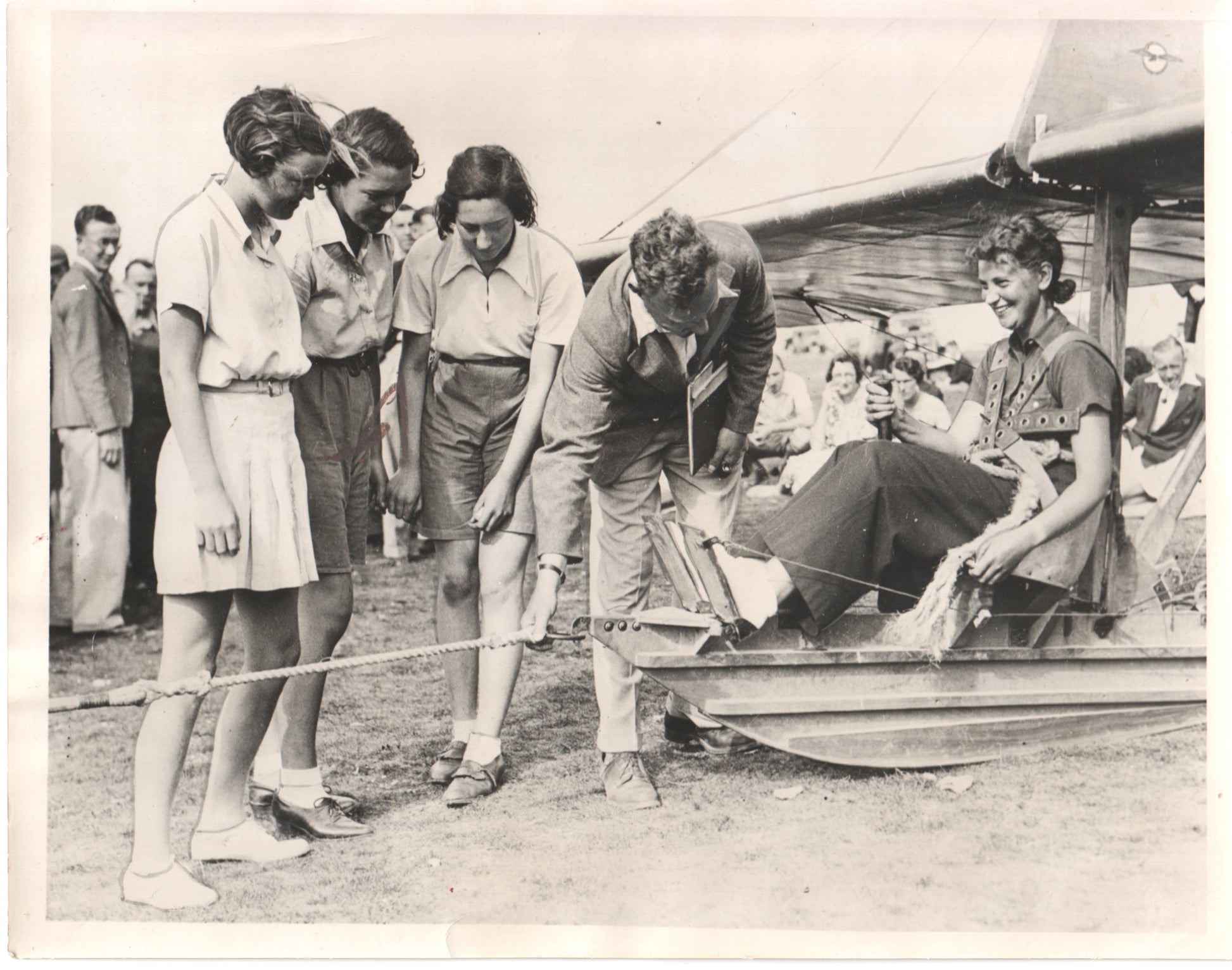 Vintage photograph of women engaging with an aircraft at an airshow in the 1930s. - Image: Folder14-5