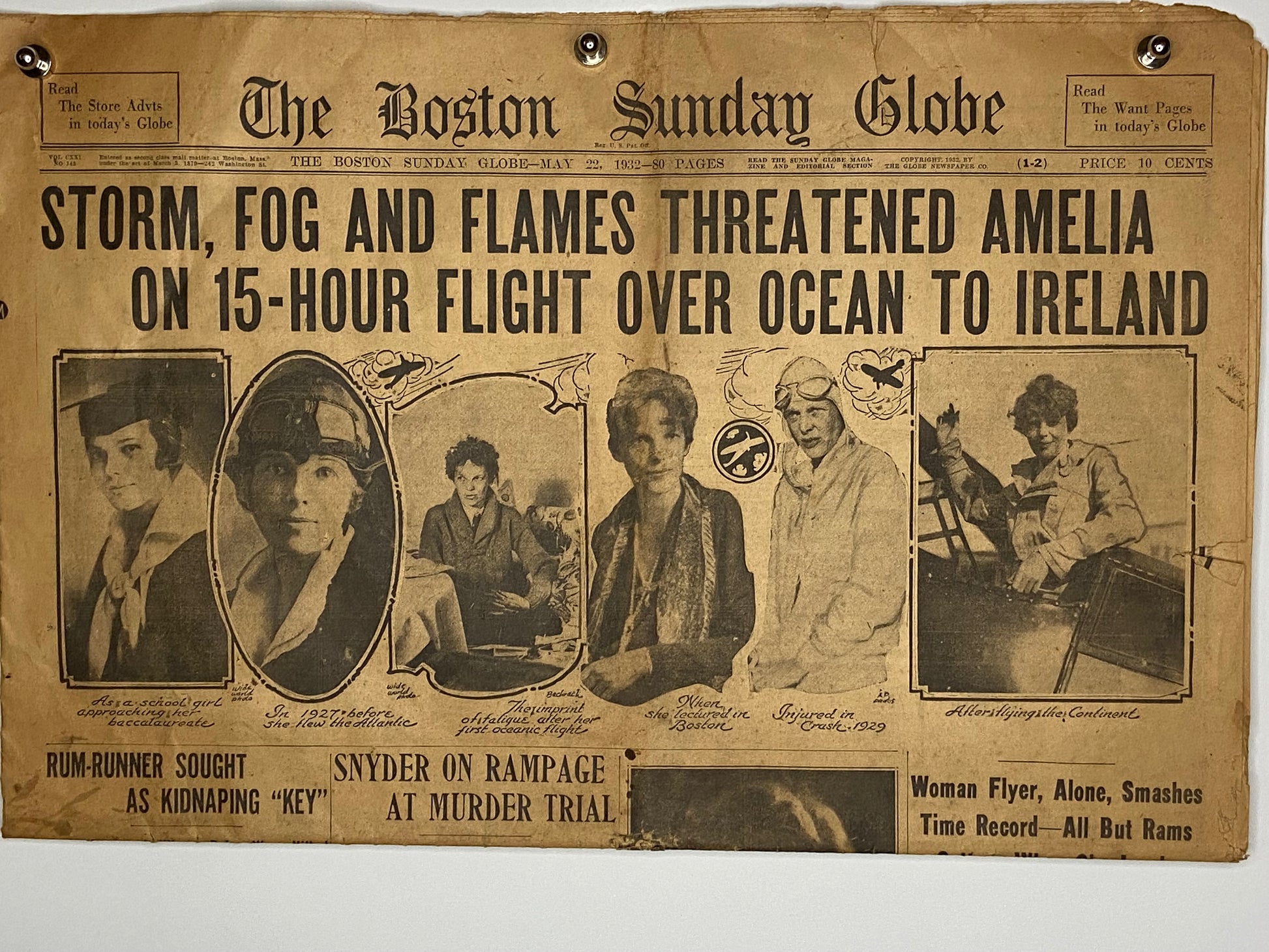 Vintage newspaper featuring Amelia Earhart's flight headline (File: F11F11IMG_1712.JPG)