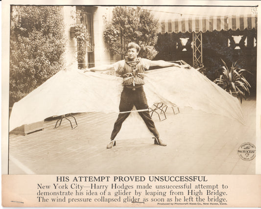 Black-and-white photo of Harry Hodges attempting to demonstrate a glider in New York City. - Image: Folder23-1