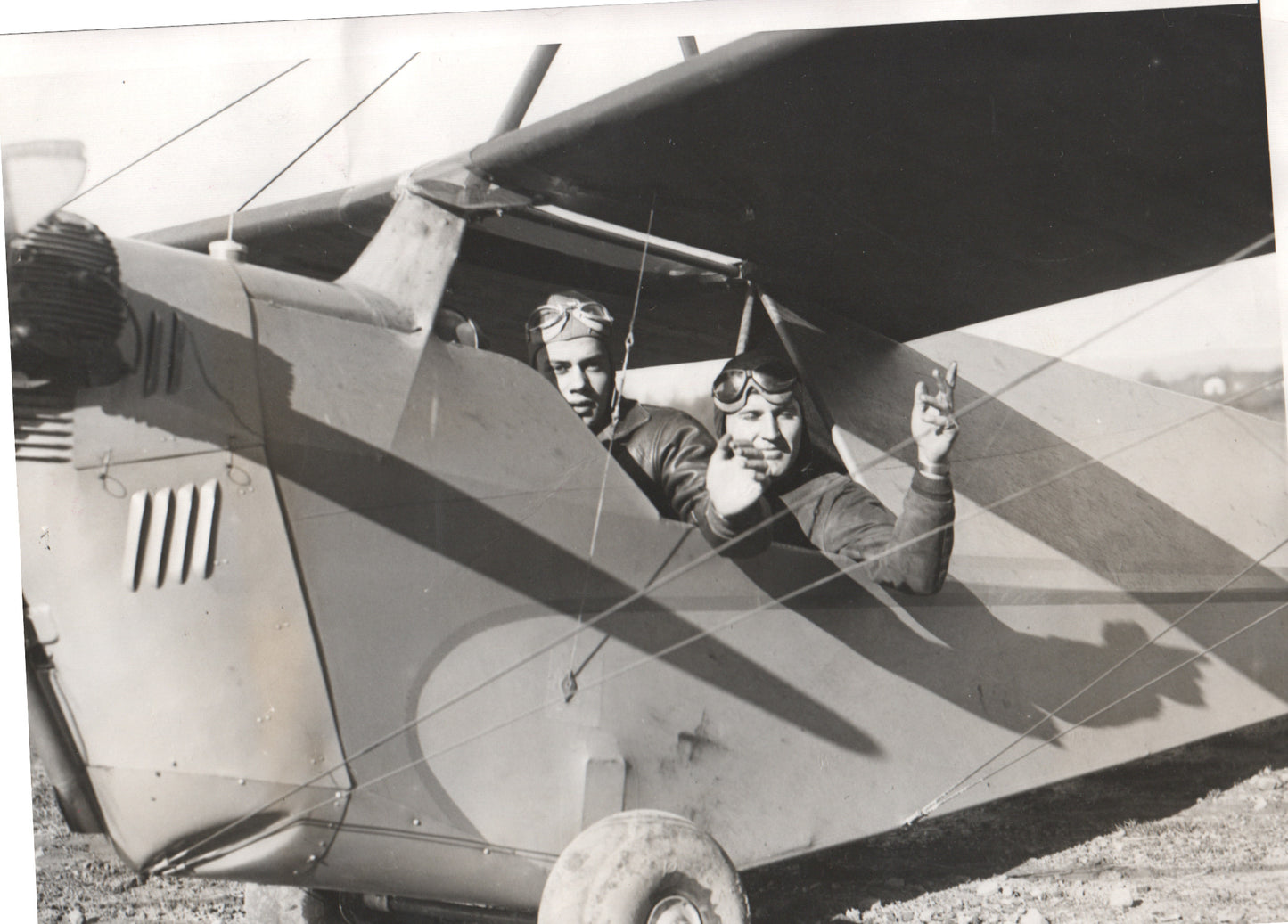 Vintage black and white photo of two aviators in a biplane. - Image: Folder3-11