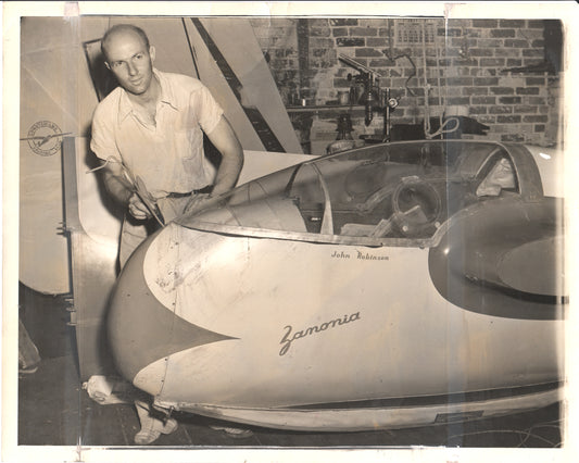 A photograph of John Robinson working on the Zanonia aircraft in a workshop. - Image: Folder25-19