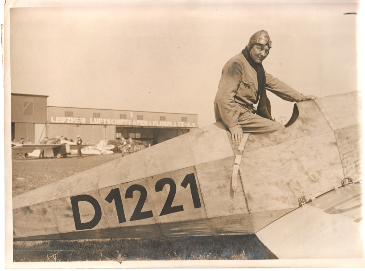 Vintage photo of a pilot sitting on an aircraft at Leipziger Luftschiffhafen. - Image: Folder16-7