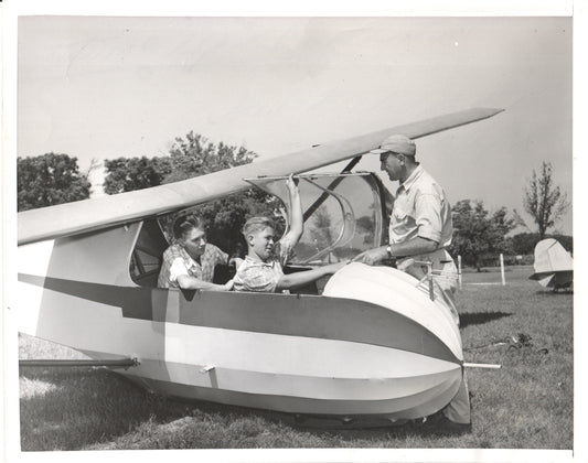 Black and white vintage photograph of boys in a glider with an instructor. - Image: Folder23-8