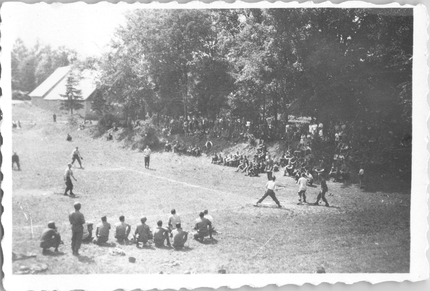 Vintage black and white photo of a baseball game with spectators in a natural setting. - Image: 2025-08-25-0054
