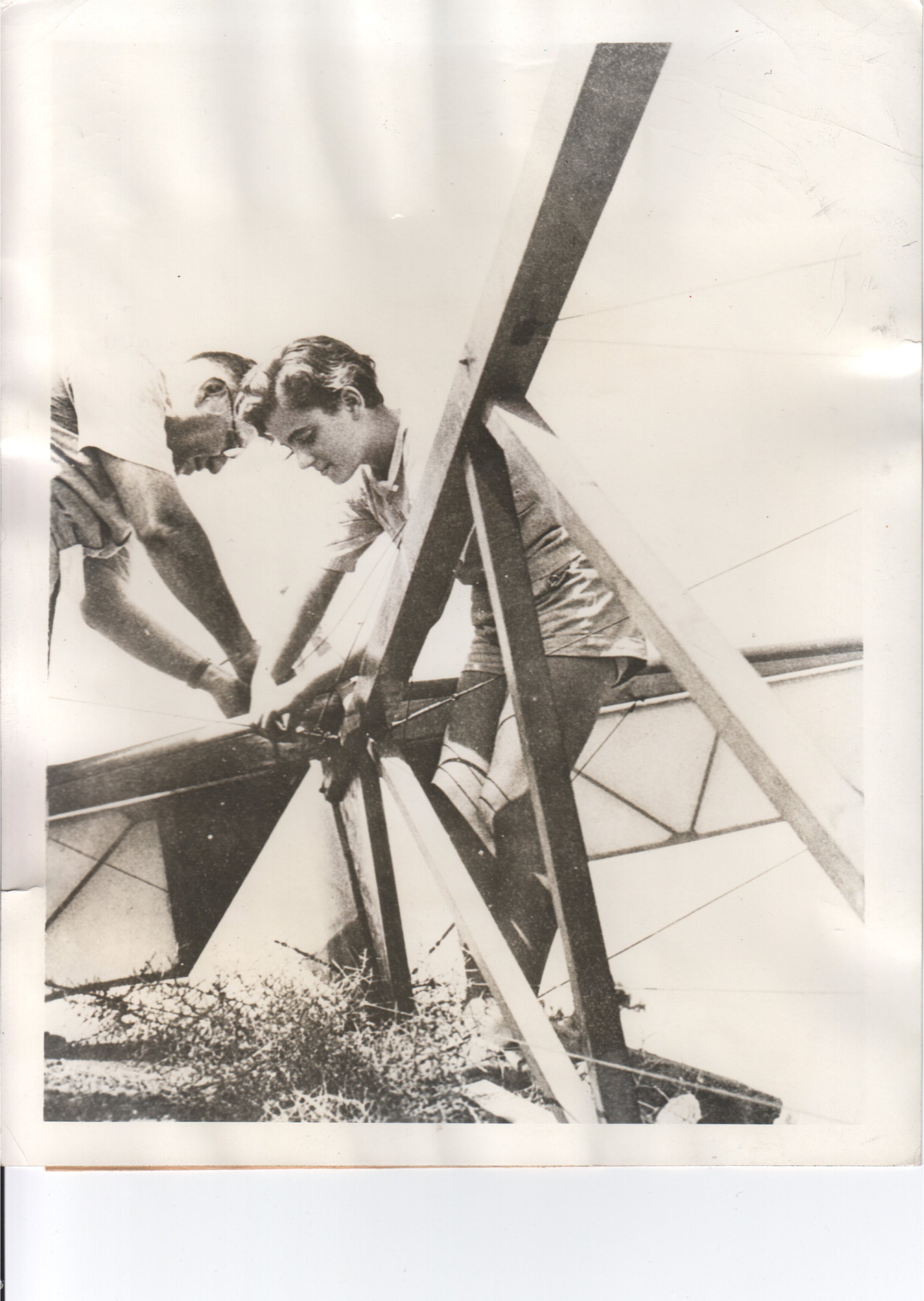 Two young men building a glider in a vintage black and white photograph. - Image: Folder3-19