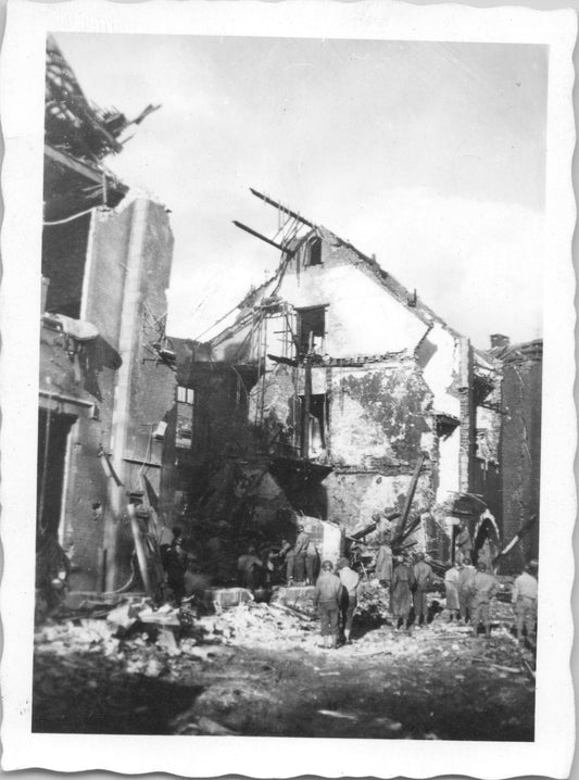 A black-and-white photograph of a damaged building during WWII. - Image: 2025-08-25-0001