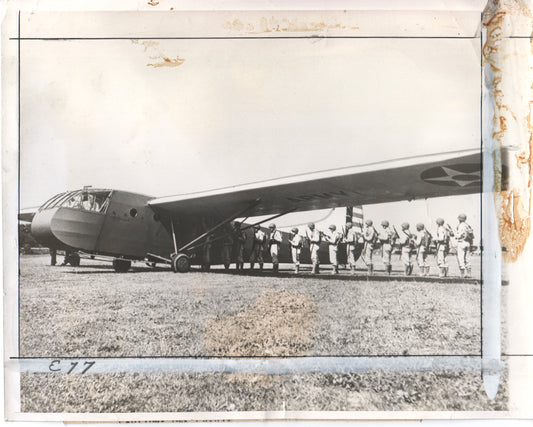 Black and white photo of a WWII military glider with paratroopers preparing for a jump. - Image: Folder14-9